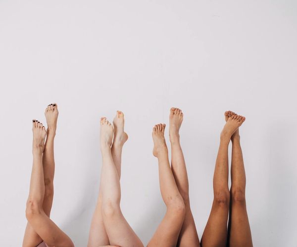 A group of diverse people relaxing after a yoga session.